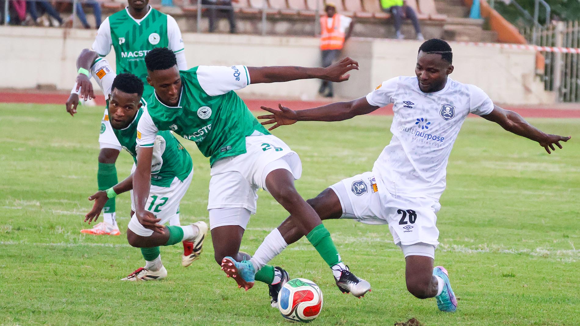 Nsingizini Hotspurs forward Simphiwe 'Kewu' Mabuza and counterpart Sizwe 'Madumane' Khumalo close in on Moneni's Reagan Kangumbu while Thando Langa looks on. (Pics:Sanele Jele)